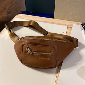 Fawn Design Fawny pack. Tan or beige in color.